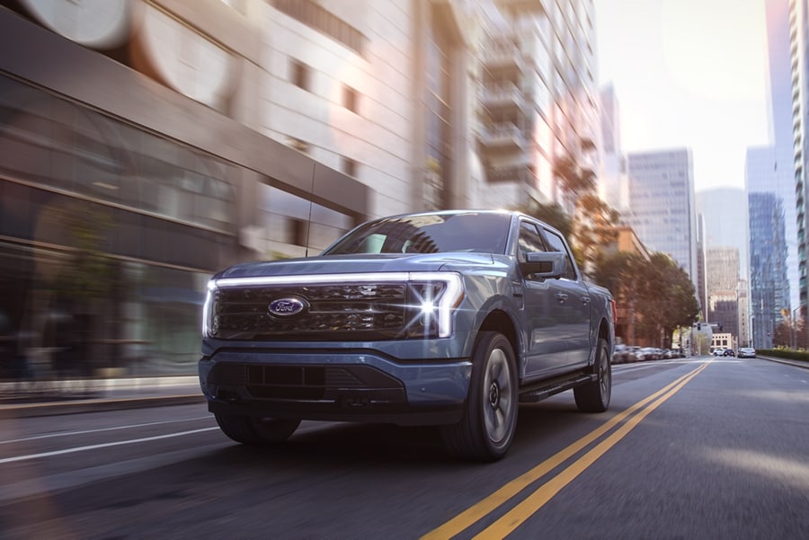 A 2023 Ford F-150 Lightning® being driven in the city